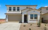two-story single-family home with a concrete driveway and desert landscaping
