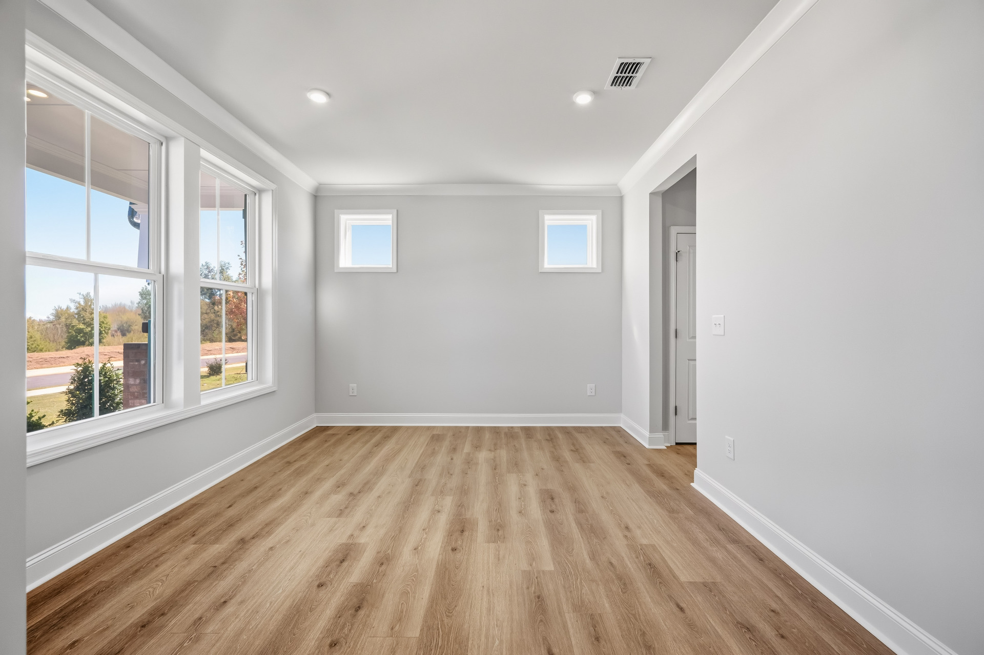 dining room with hard-surface flooring and butler's pantry
