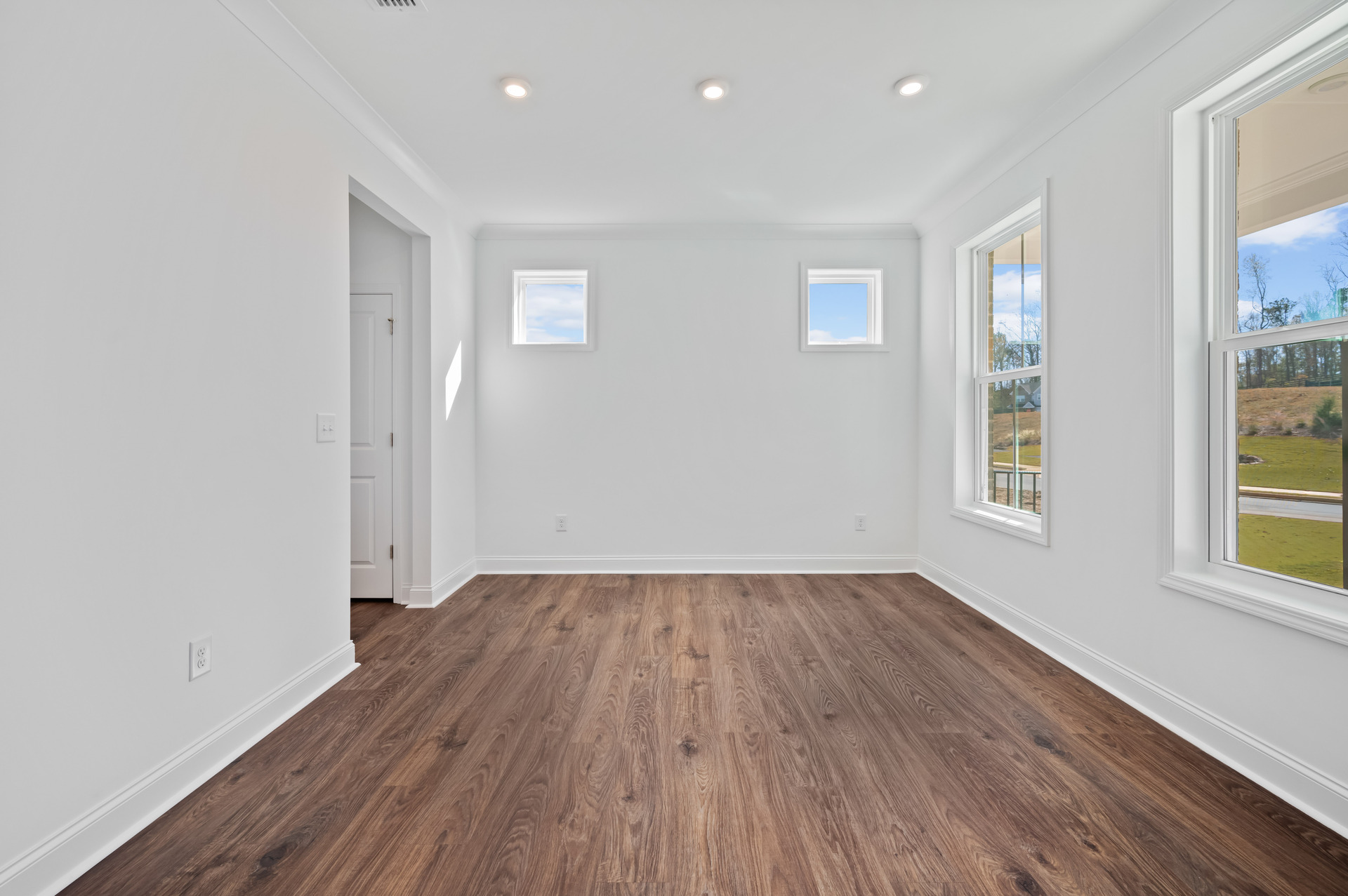 dining room with hard-surface flooring and butler's pantry