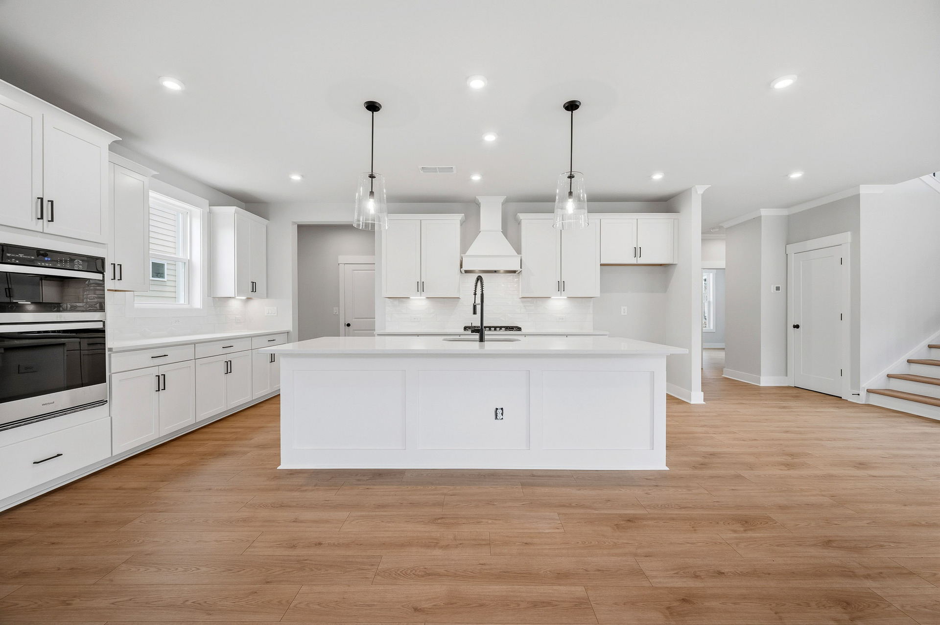kitchen with white cabinets and quartz counters