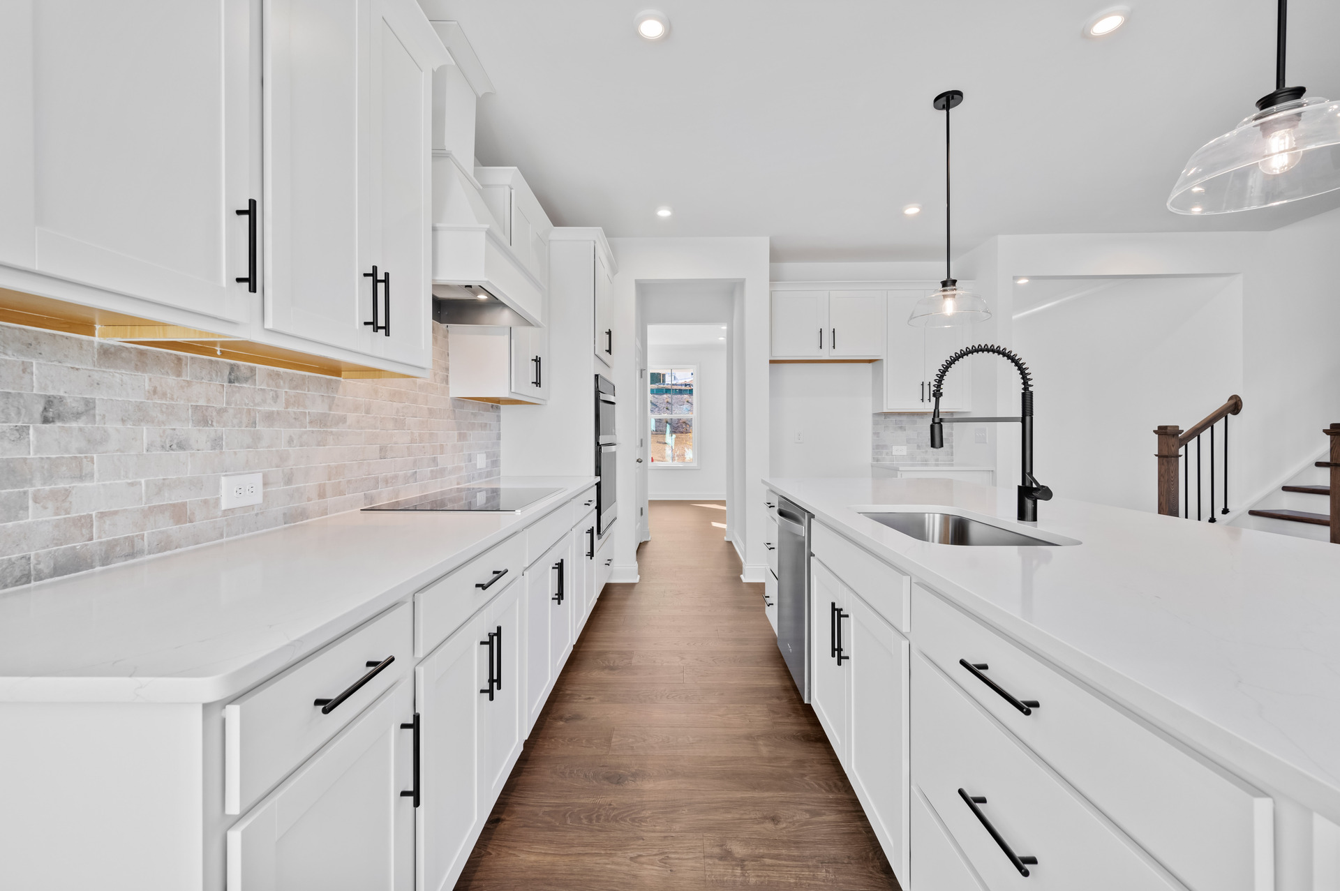 kitchen with large center island and white cabinets