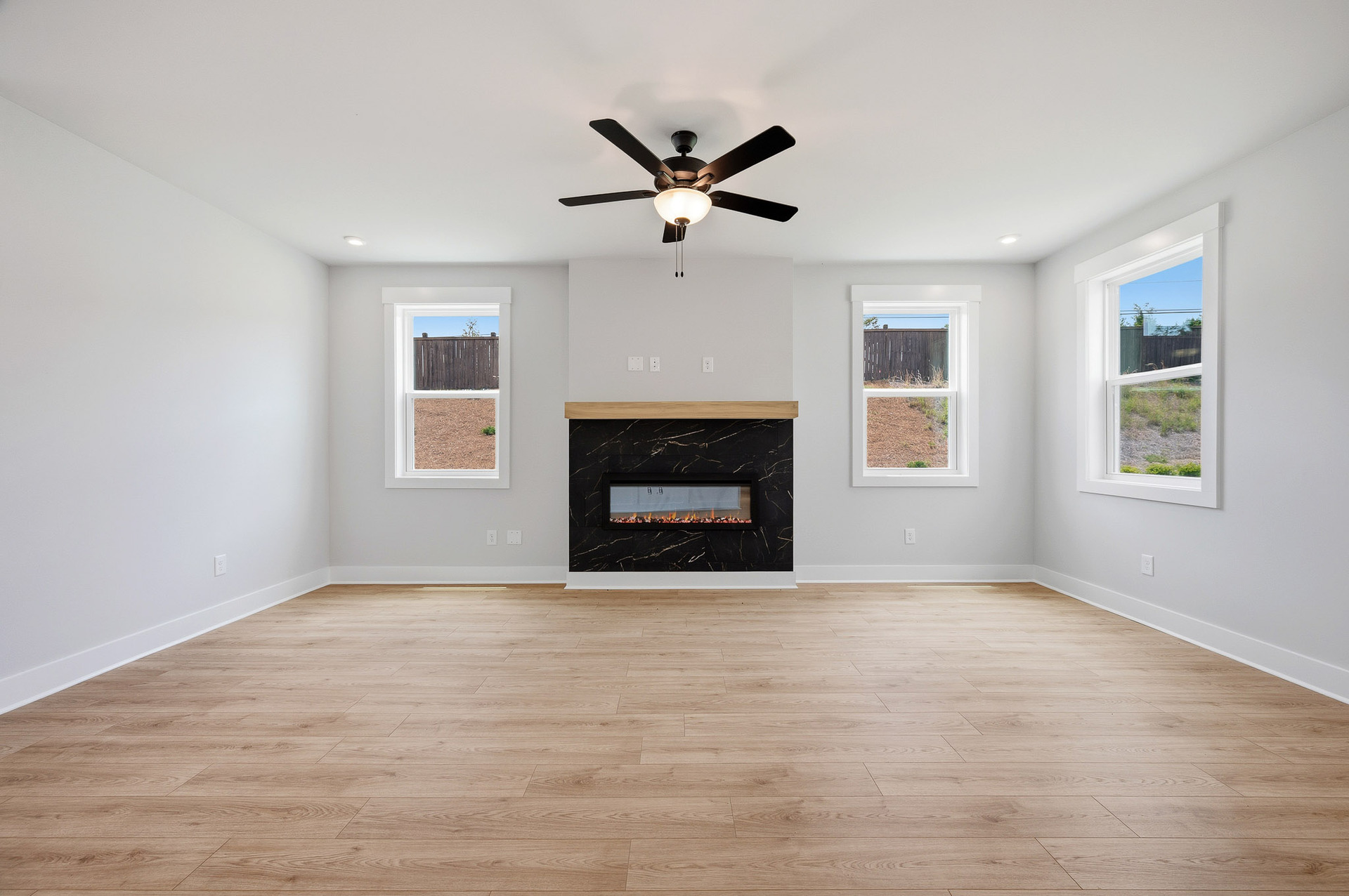 great room with electric fireplace and hard surface flooring