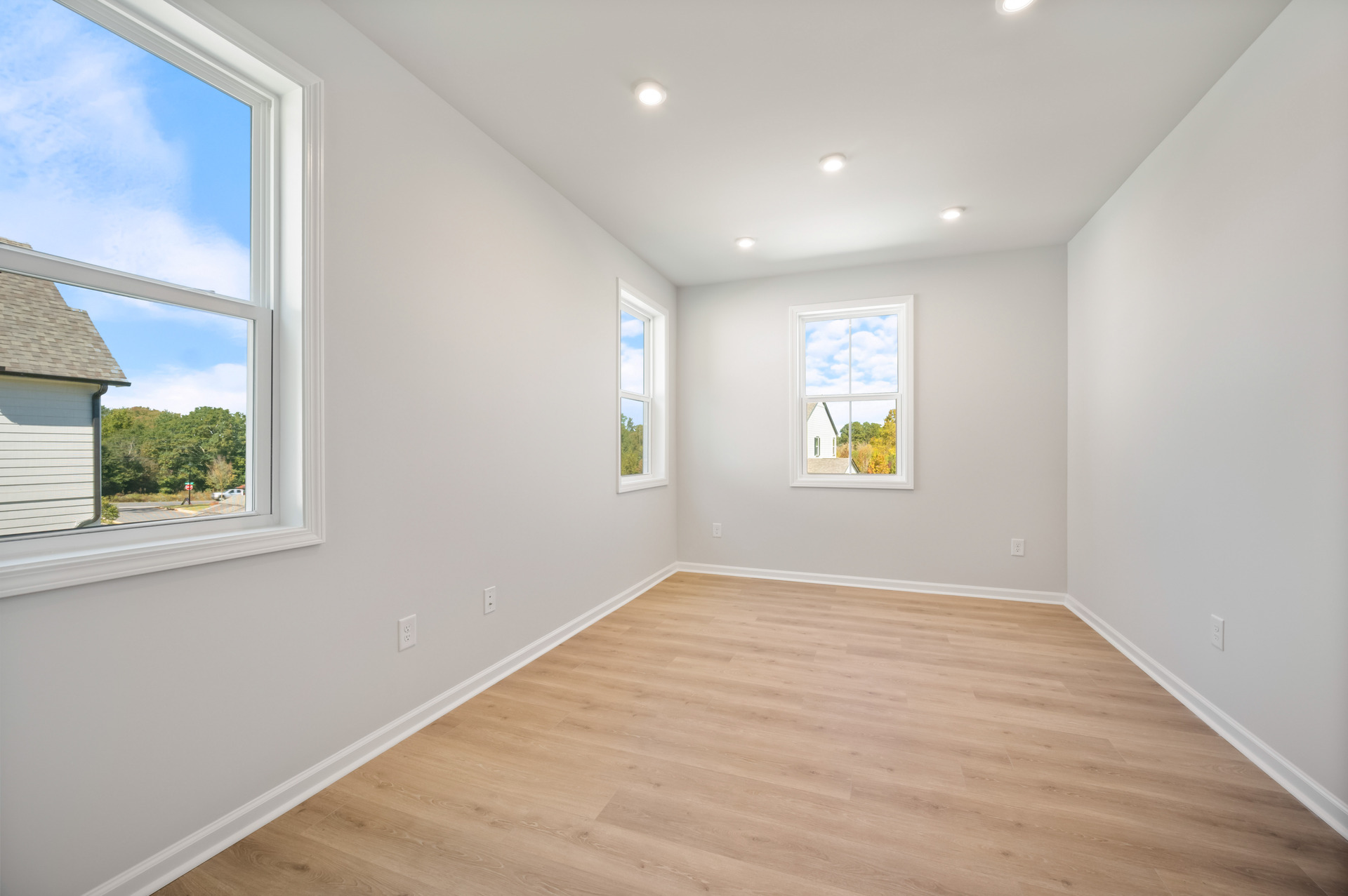 loft with hard-surface flooring and windows