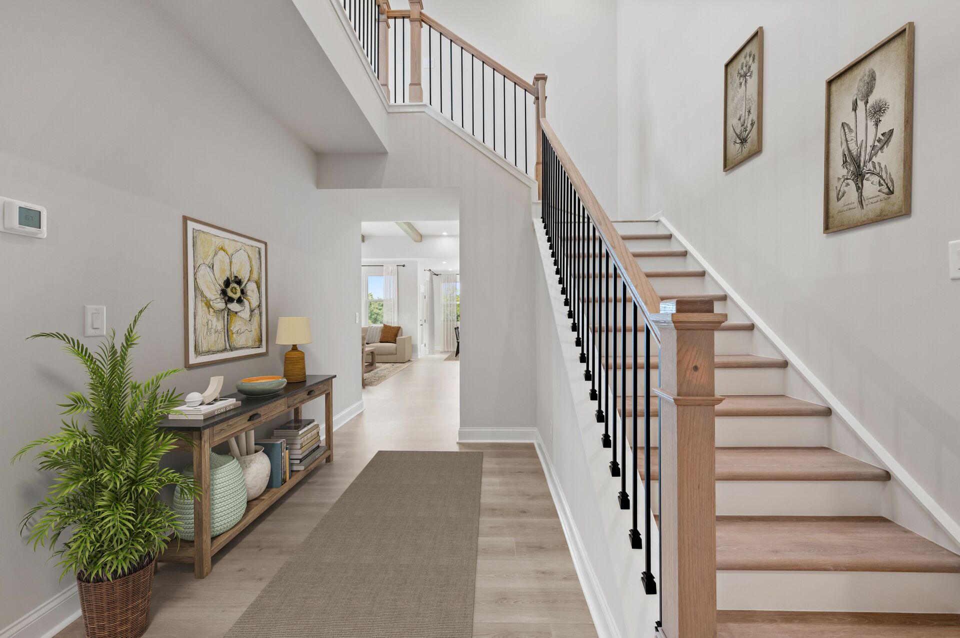 foyer with decor and stairs with plank treads