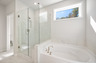 primary bath with separate shower and tub