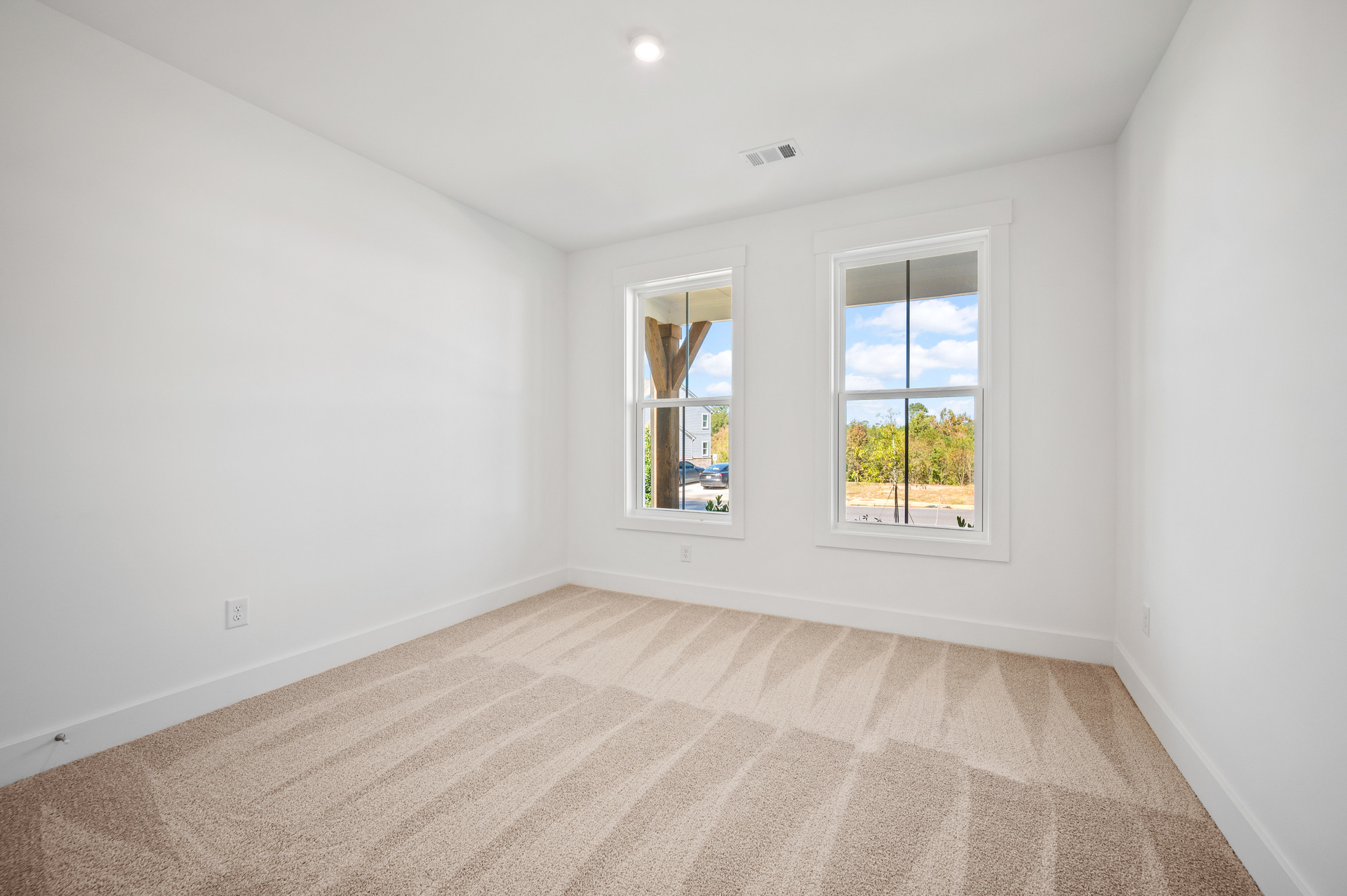 secondary bedroom with carpet and attached bath