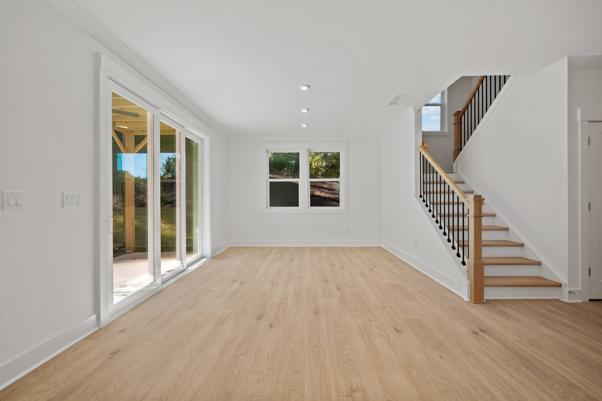 dining room with hard-surface flooring open to the kitchen and great room