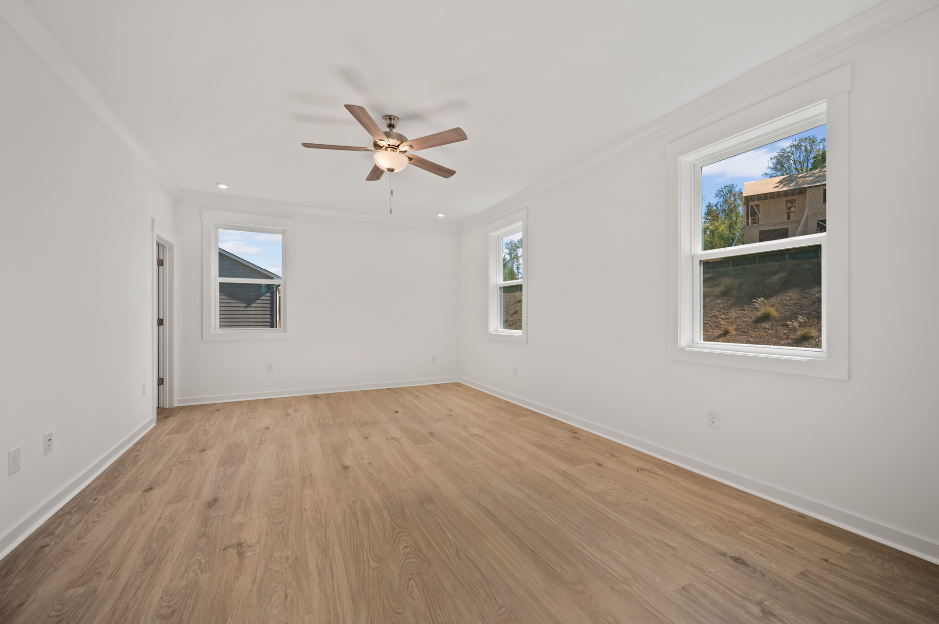 primary bedroom with carpet and attached covered deck