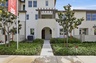 exterior of townhome with neutral paint and balcony