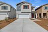 two-story exterior with a white windowless garage and a red front door
