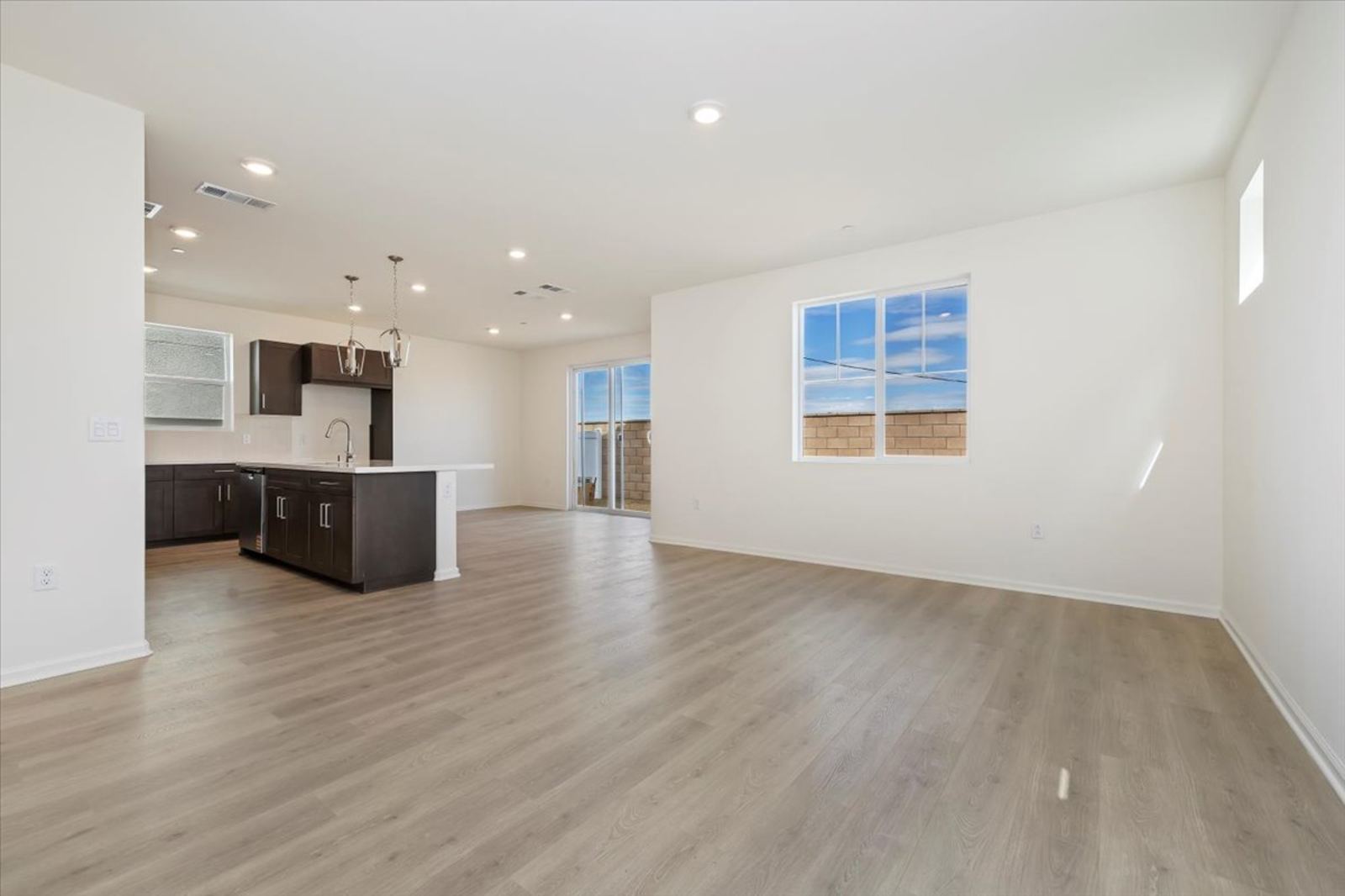 great room featuring the kitchen and dining room in the background