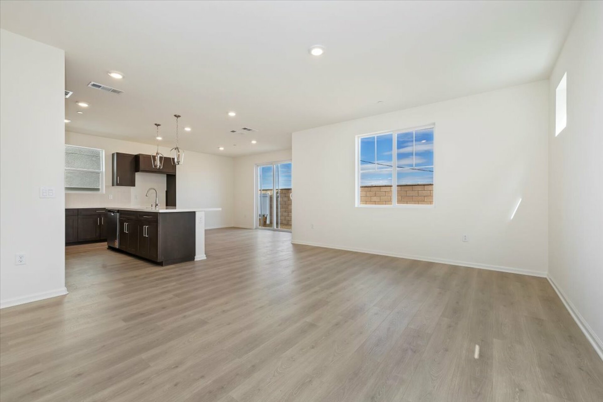 great room featuring the kitchen and dining room in the background