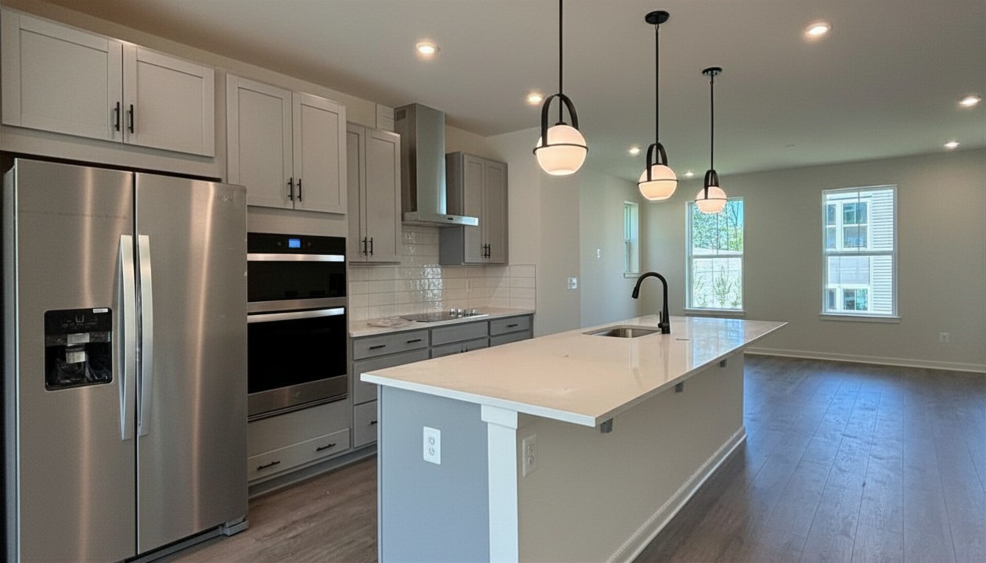 kitchen with gray cabinets and stainless steel appliances