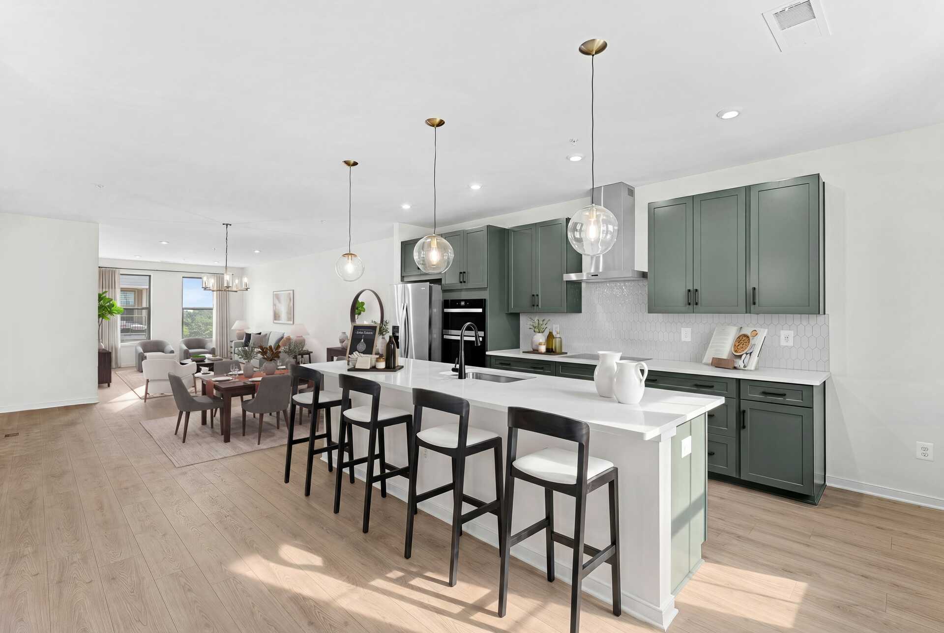 kitchen island with Chairs and pendant lighting