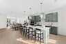 kitchen island with Chairs and pendant lighting