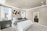 bedroom with dresser and artwork 
