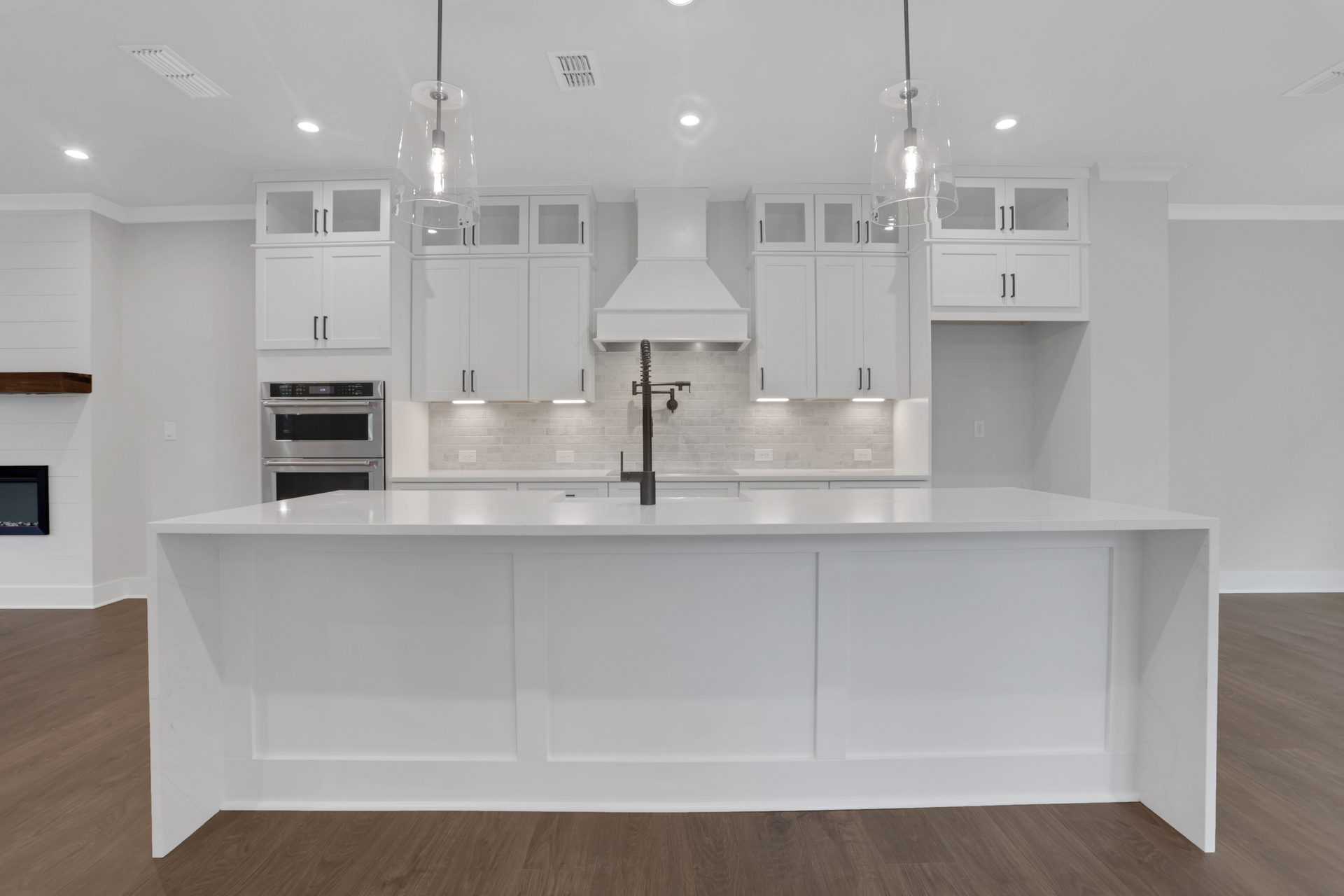 kitchen with white cabinets and quartz counters