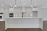 kitchen with white cabinets and quartz counters