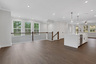 dining room with hard surface flooring and 2-story foyer
