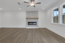 great room with electric fireplace and hard surface flooring