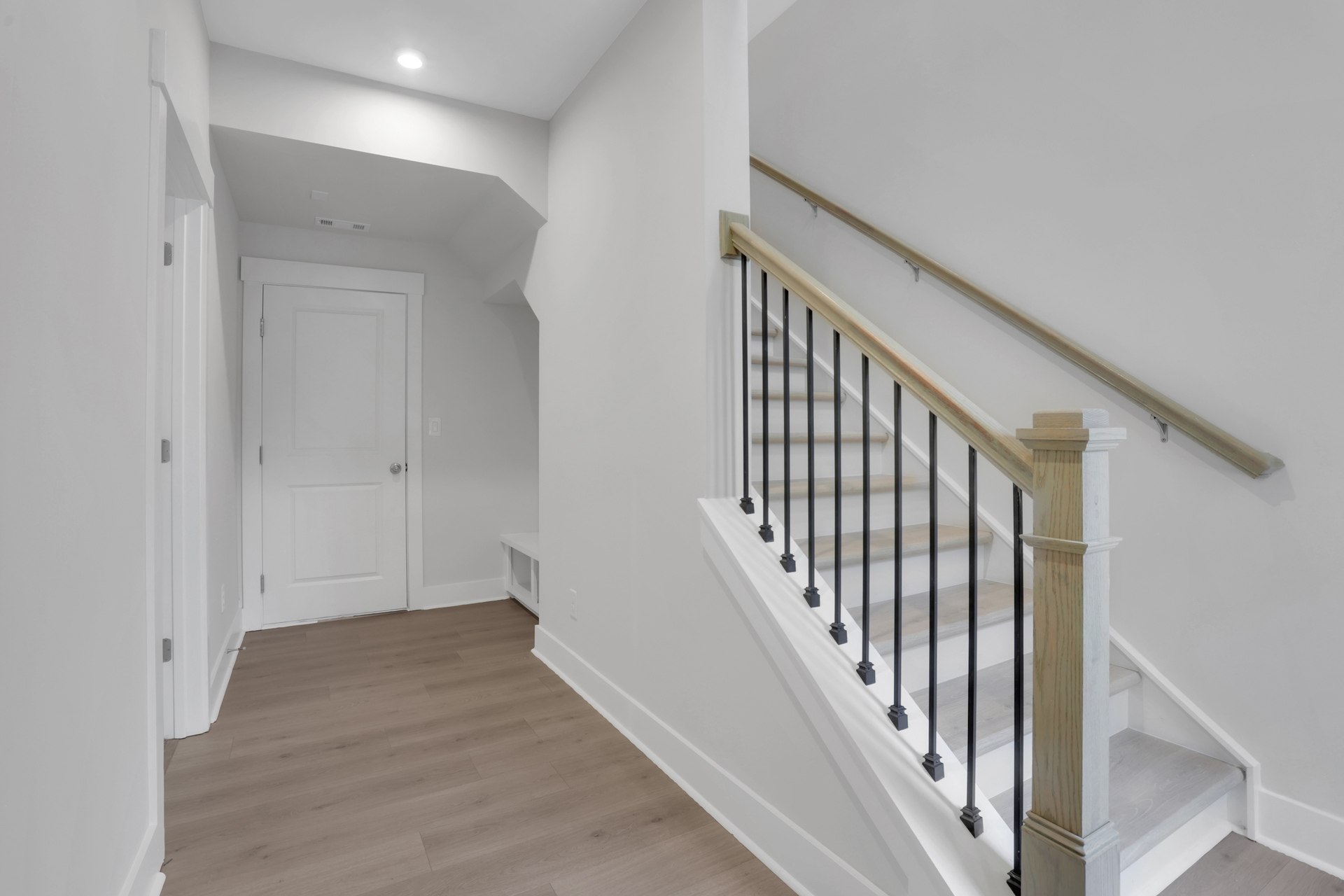 foyer with hard surface flooring and stairs