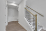 foyer with hard surface flooring and stairs