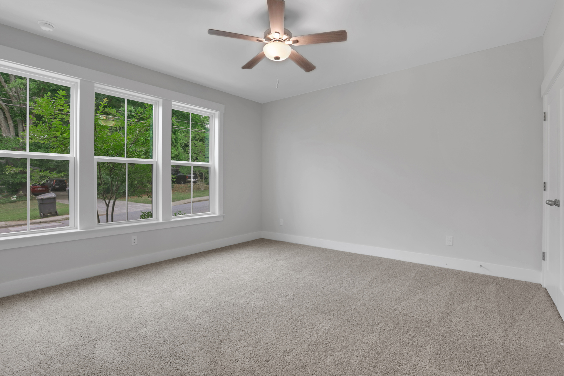 bedroom with windows and carpet