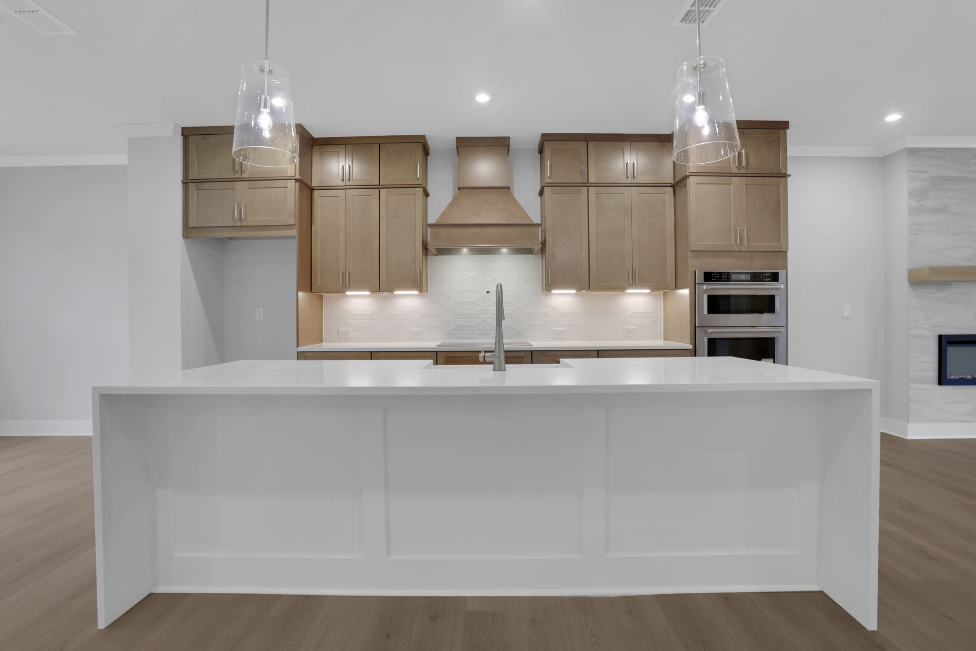 kitchen with wood-finish cabinets and quartz counters