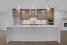 kitchen with wood-finish cabinets and quartz counters