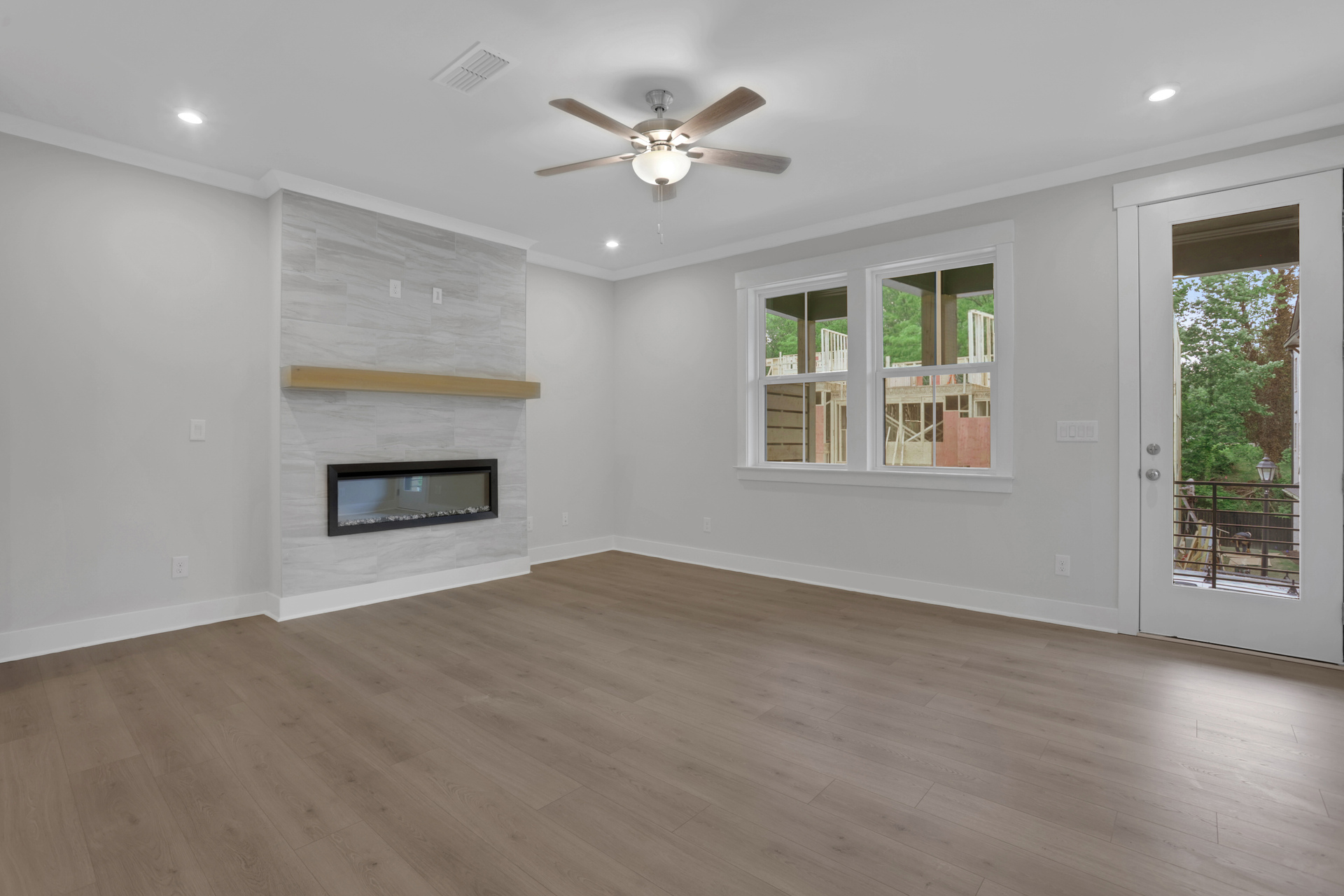great room with electric fireplace and hard surface flooring
