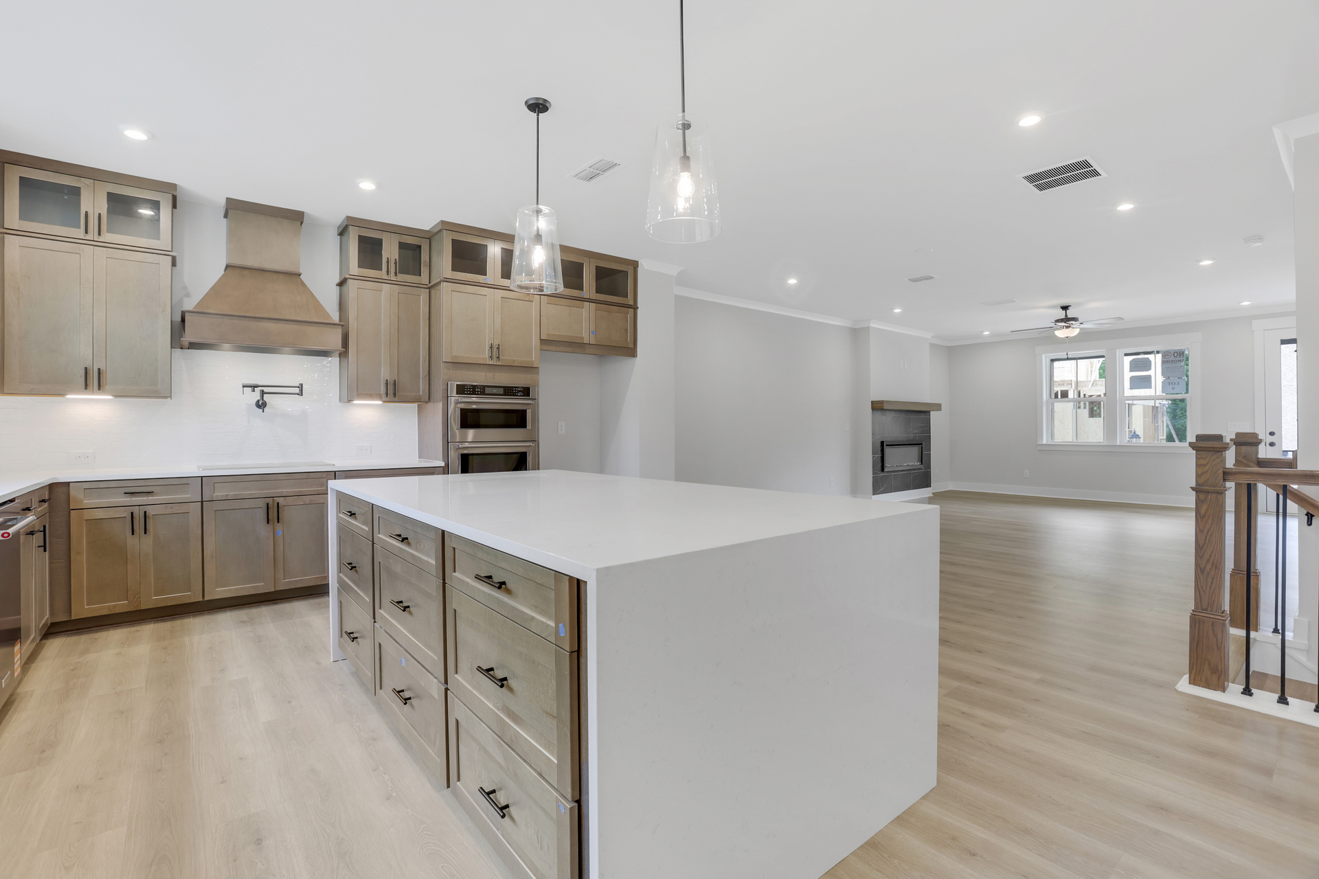 kitchen with wood-finish cabinets and quartz counters