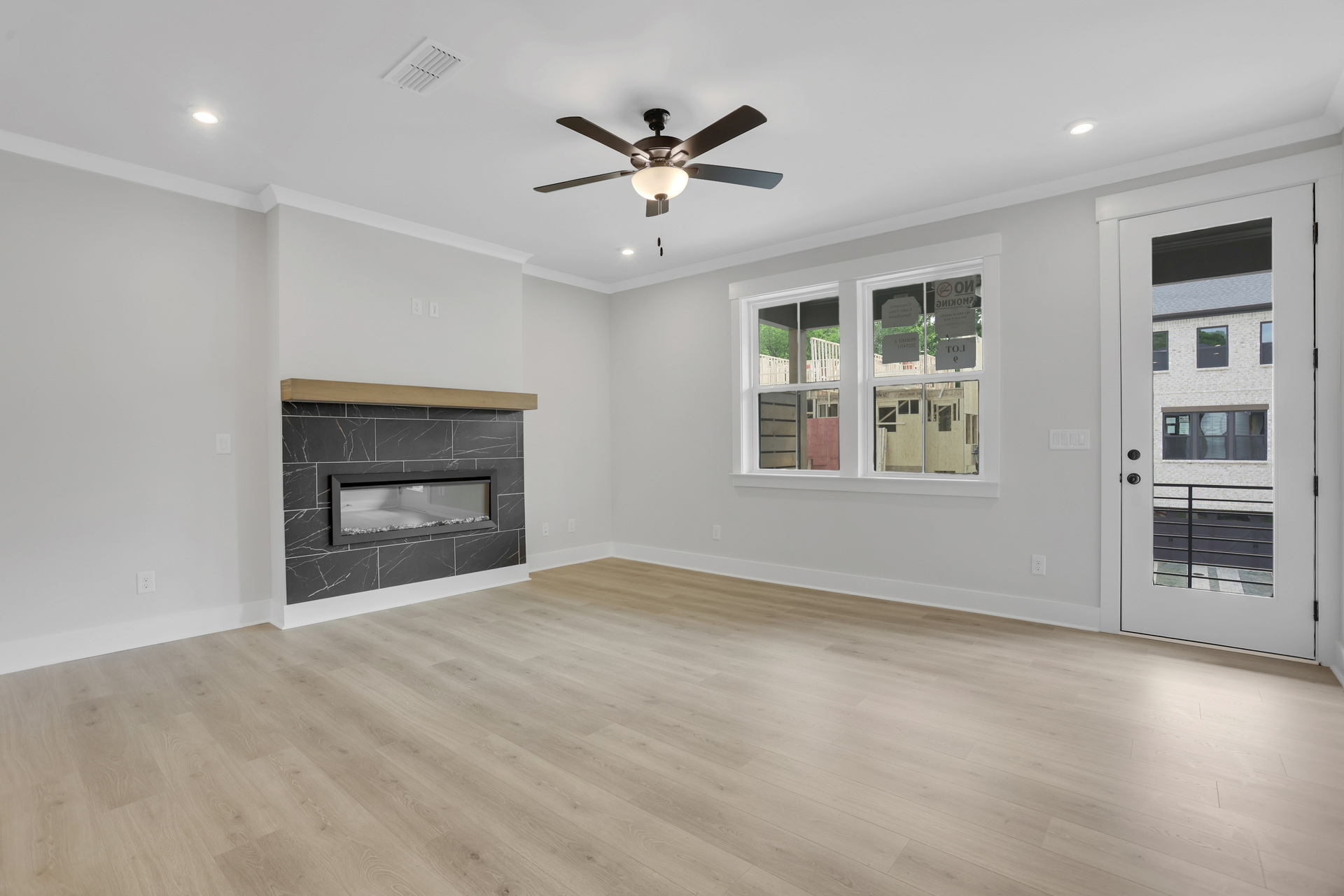 great room with electric fireplace and hard surface flooring