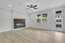 great room with electric fireplace and hard surface flooring