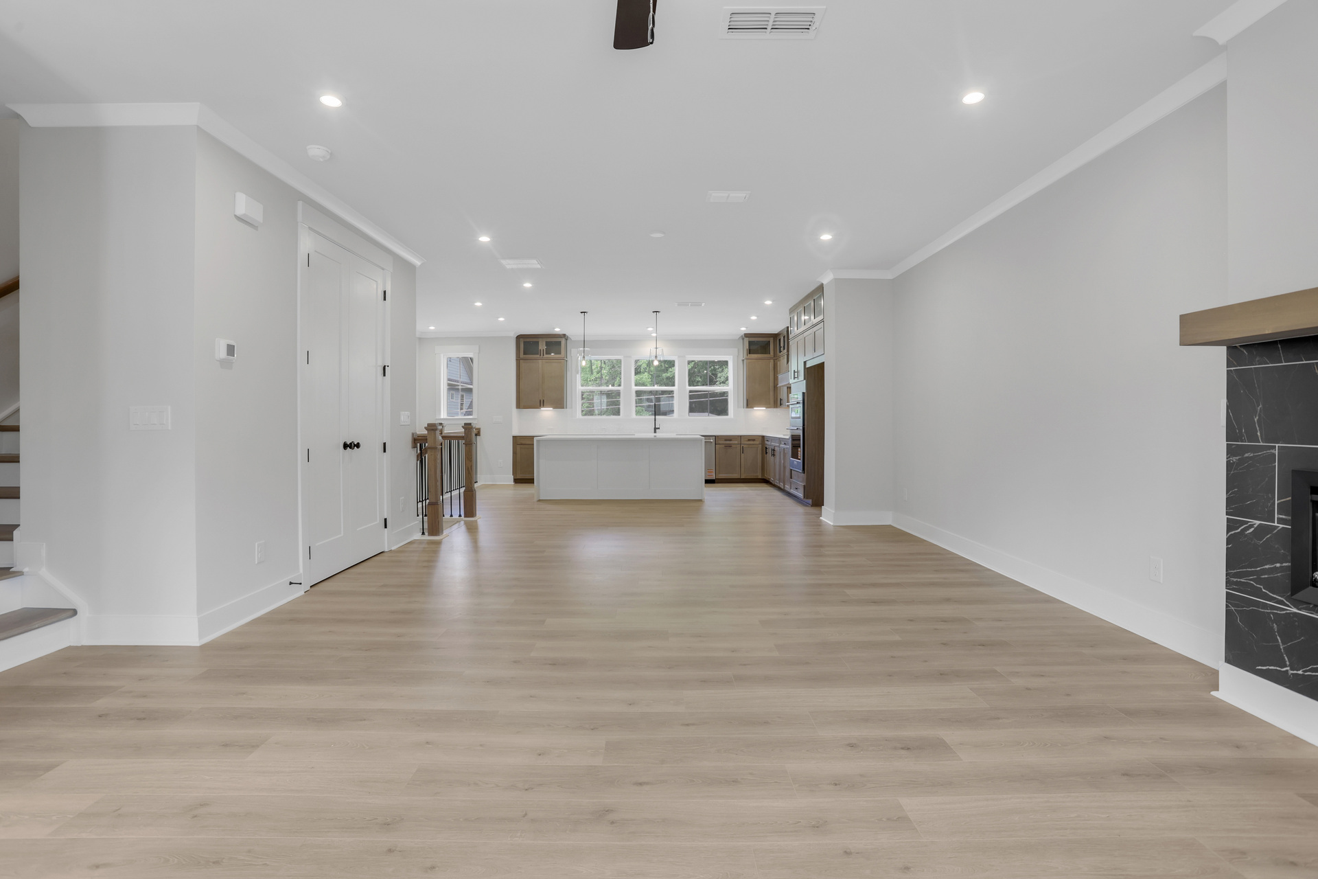 dining room with hard surface flooring open to the kitchen and great room