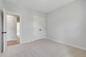 bedroom with walk-in closet and carpet