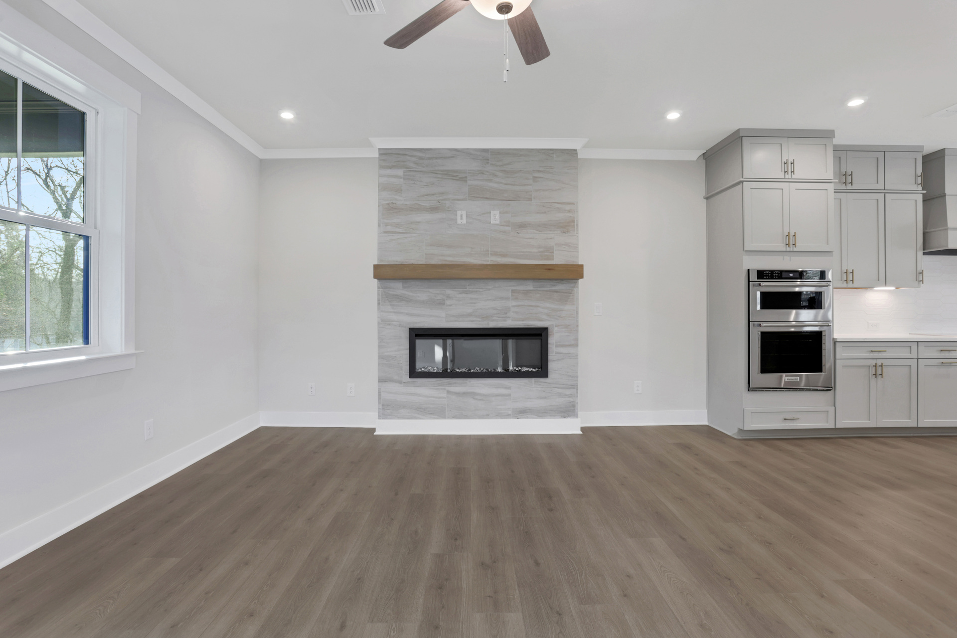 great room with electric fireplace and hard surface flooring