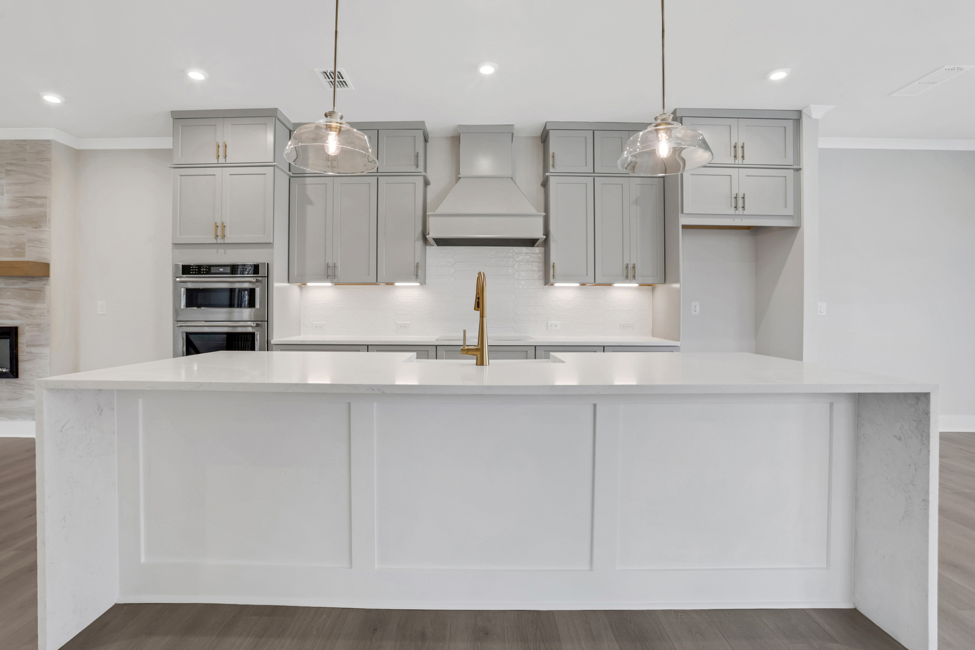 kitchen with white cabinets and white quartz counters