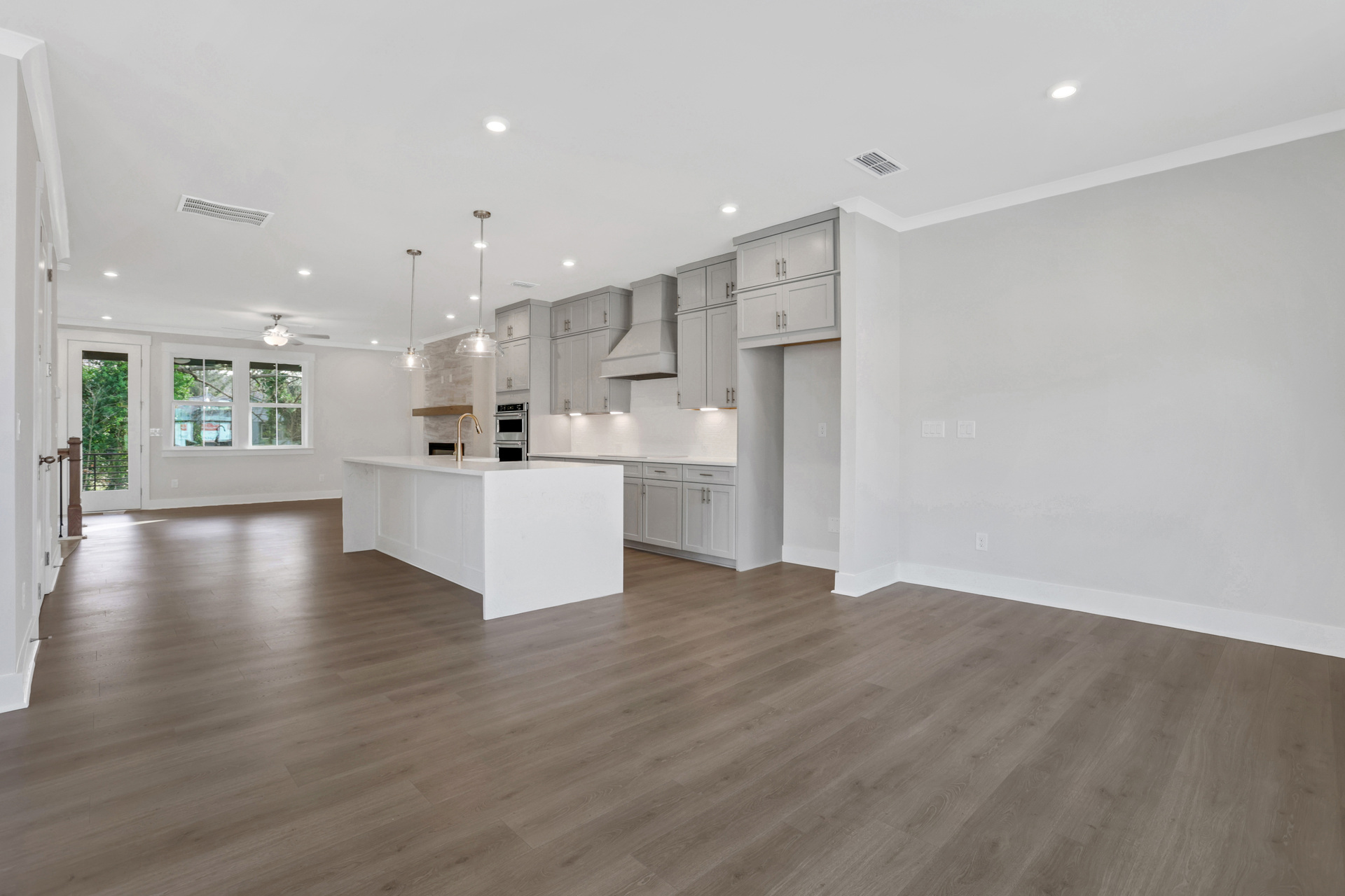 dining room with hard surface flooring open to the kitchen