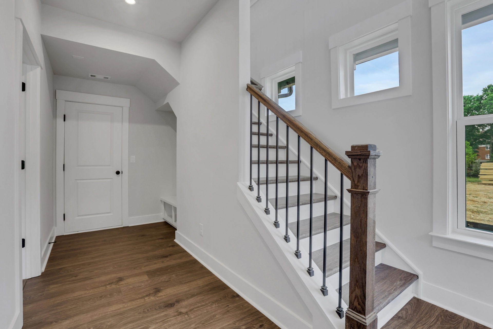 foyer with hard surface flooring and windows