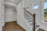 foyer with hard surface flooring and windows