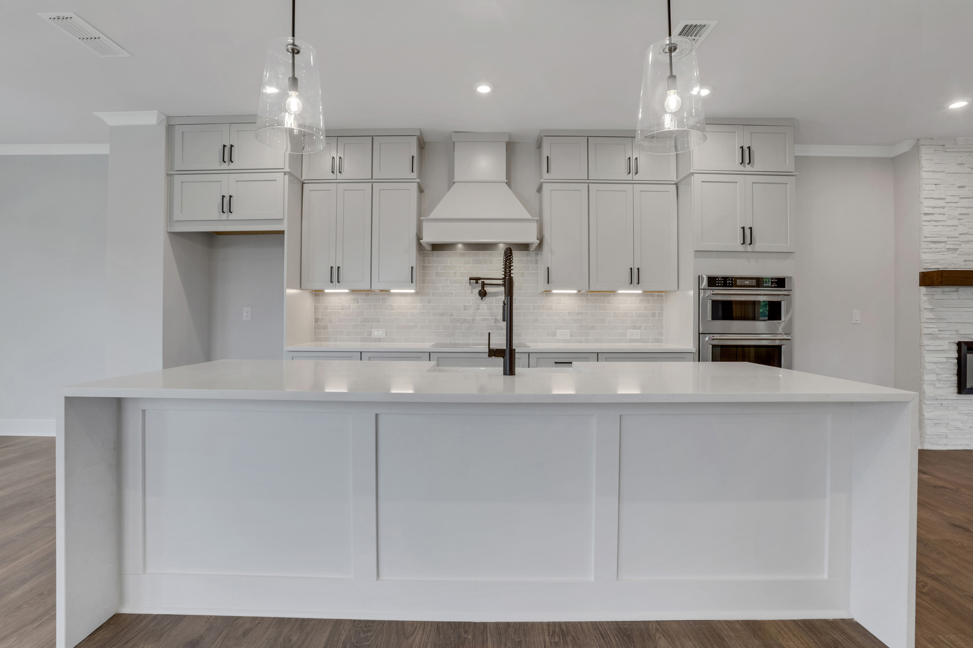 kitchen with white cabinets and quartz counters