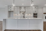 kitchen with white cabinets and quartz counters