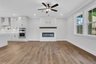 great room with electric fireplace and hard surface flooring