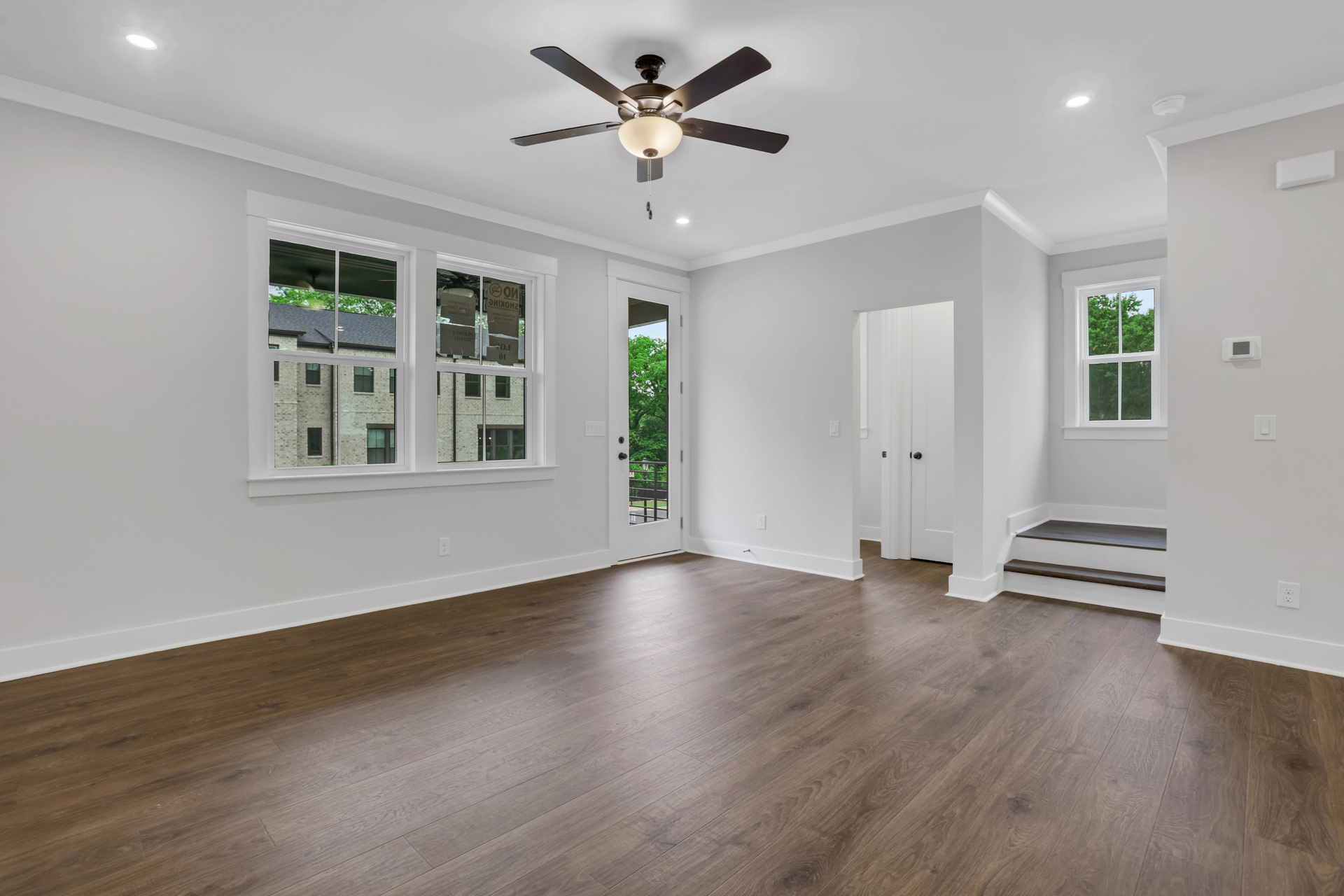 great room with electric fireplace and hard surface flooring
