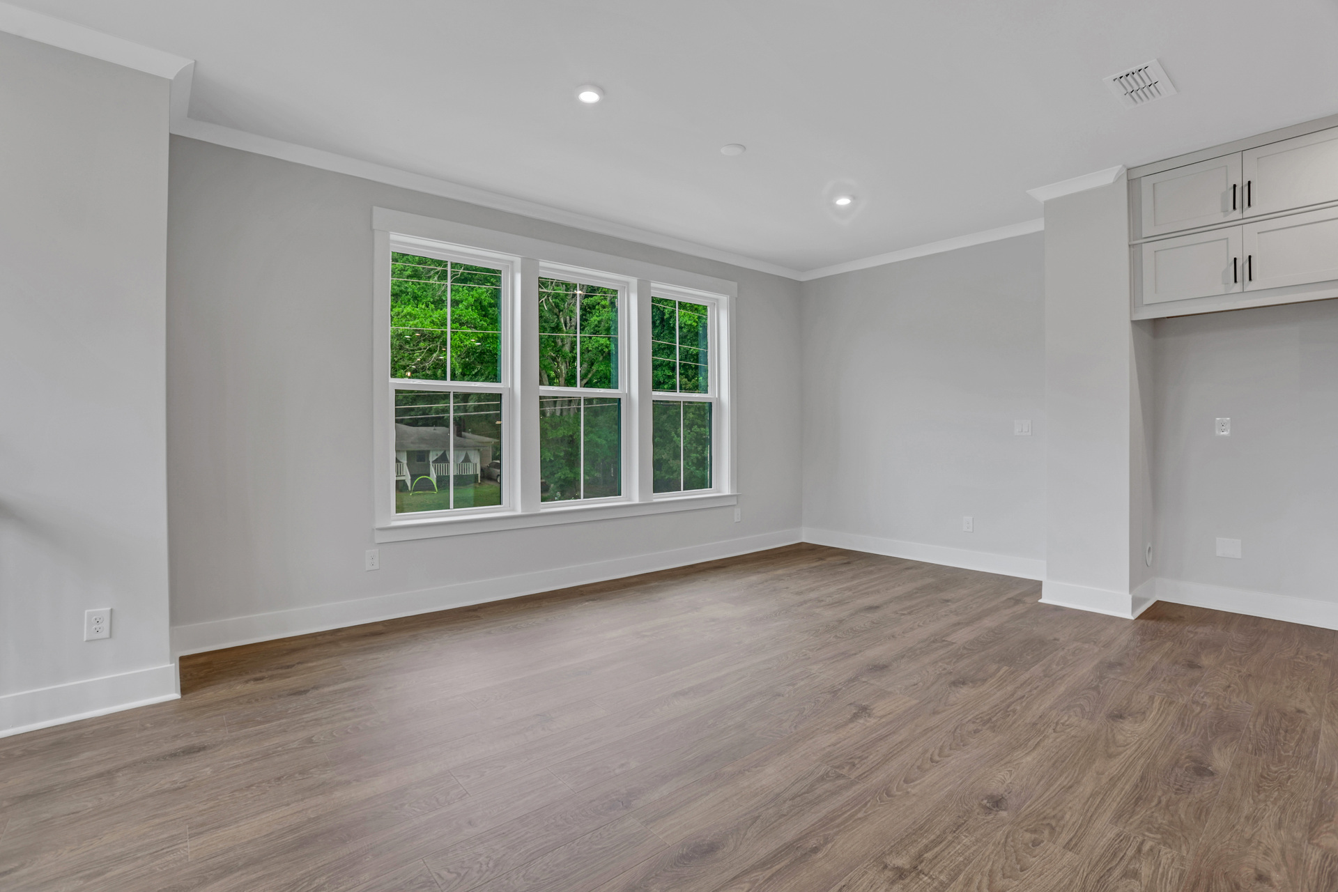 Dining room with hard surface floors and windows