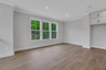Dining room with hard surface floors and windows
