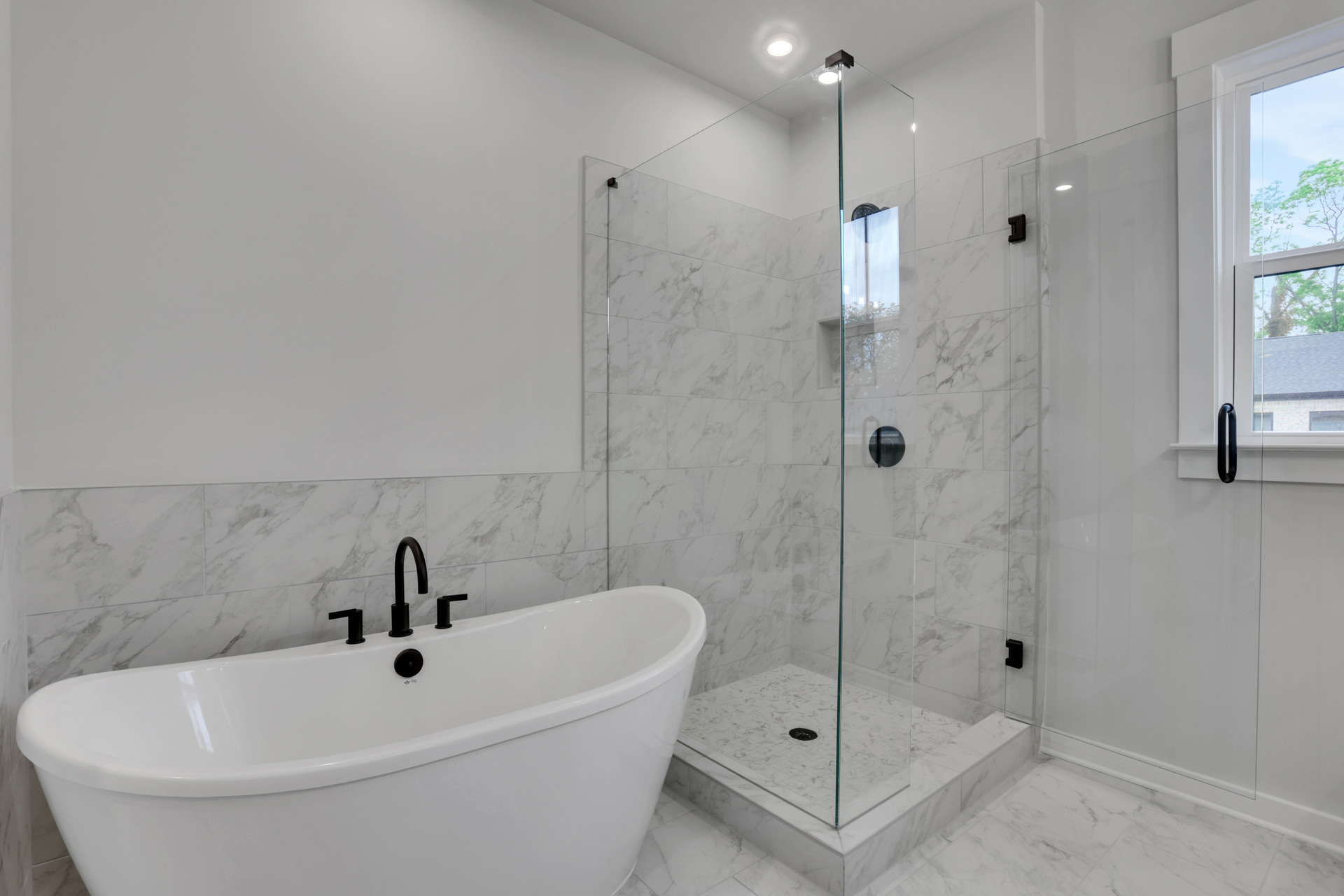 primary bathroom with walk-in shower and soaker tub