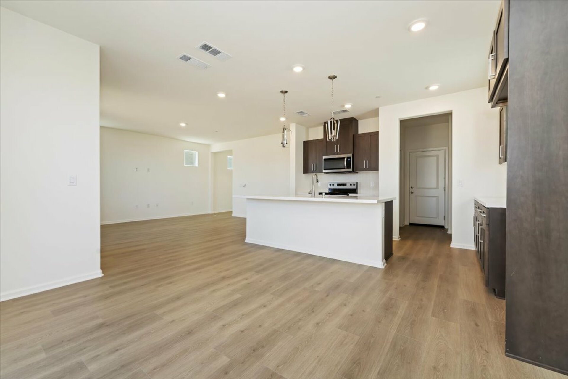 kitchen with dark brown cabinets and a large island