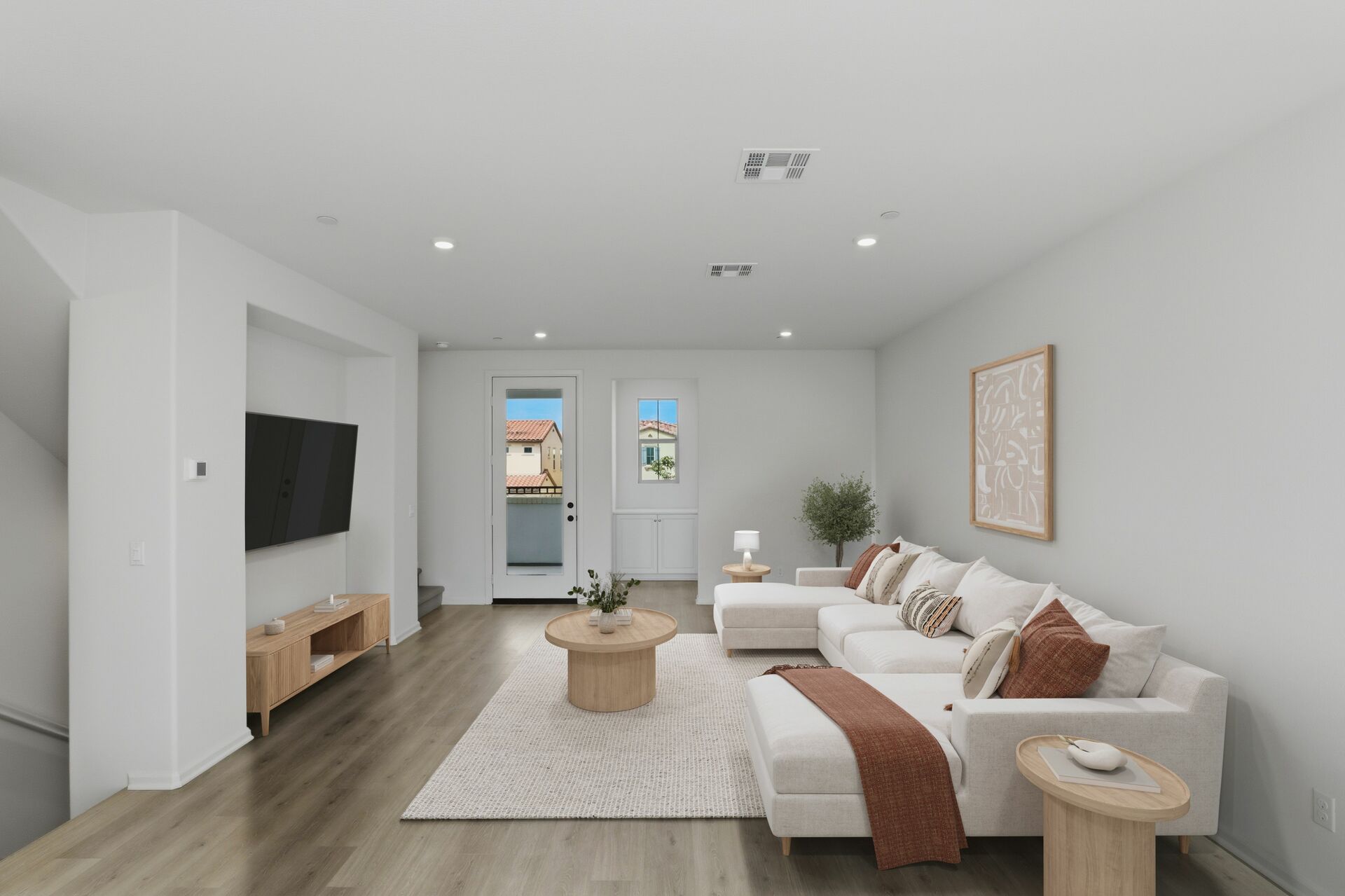 living room with neutral floors and balcony