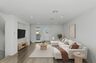 living room with neutral floors and balcony